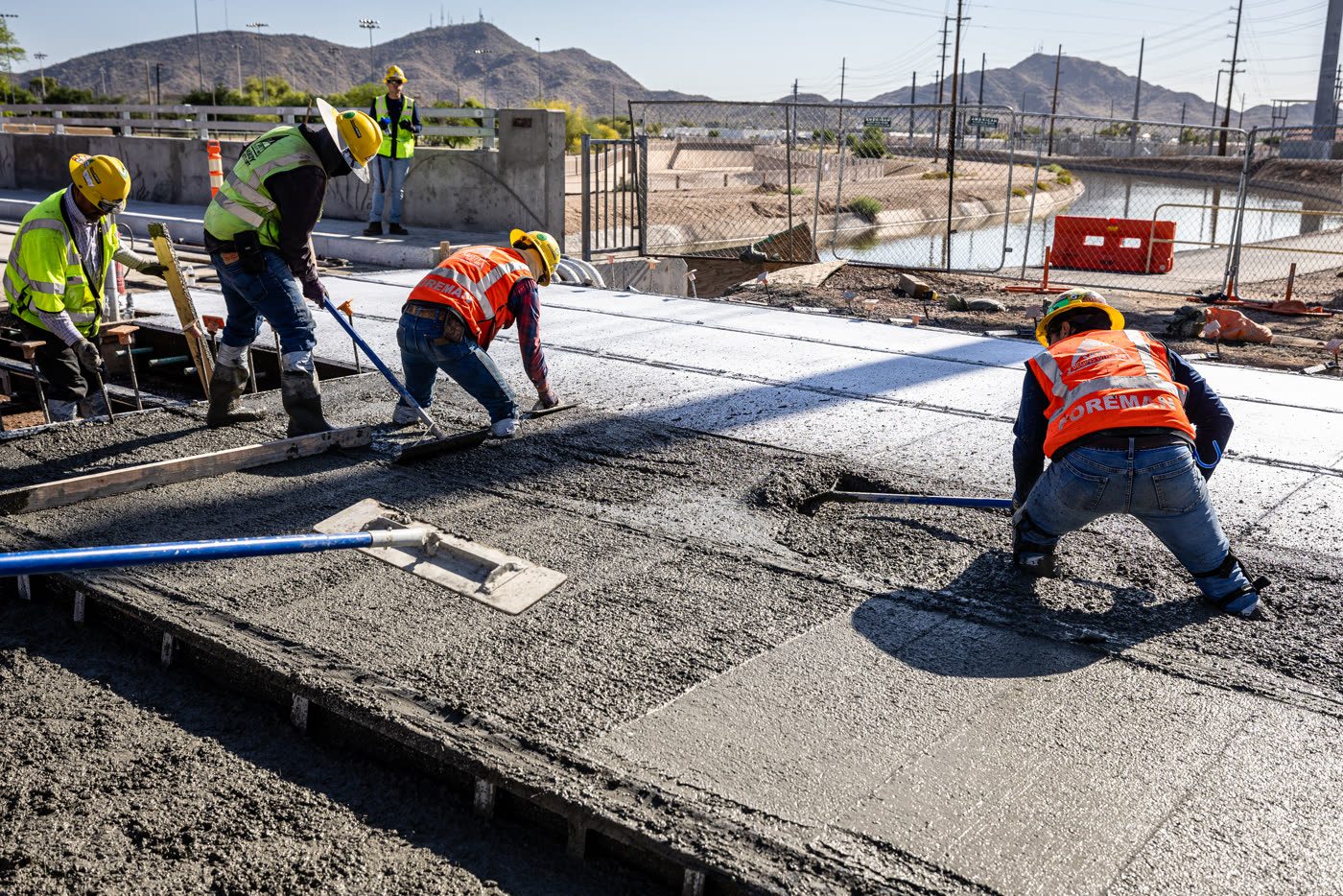 Crews placing fiber reinforced concrete for the Valley Metro light rail track slab