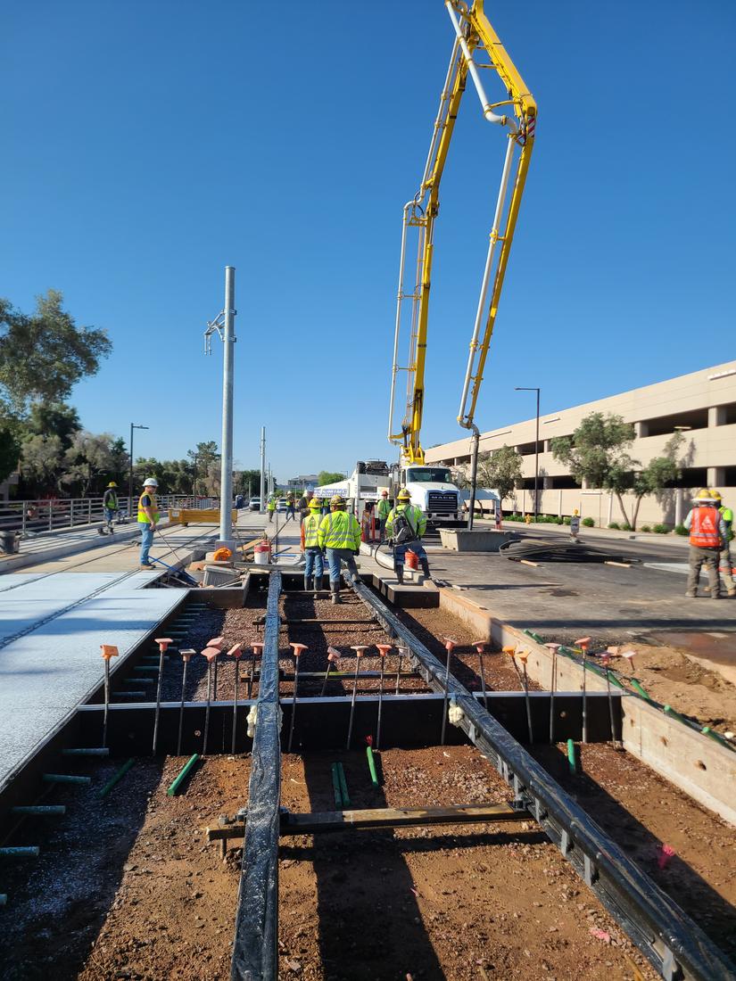 A concrete pump boom over the track slab formwork